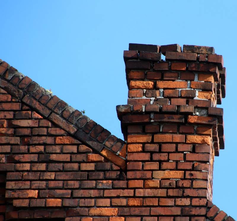 Blog Article - Damaged chimney on an Haslet home showing cracks and missing mortar